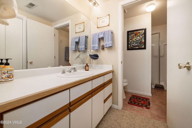 407 Meadow Rd, Edwards, CO 81632 - bathroom with toilet, vanity, tile patterned floors, and baseboards