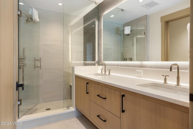 bathroom with vanity and walk in shower