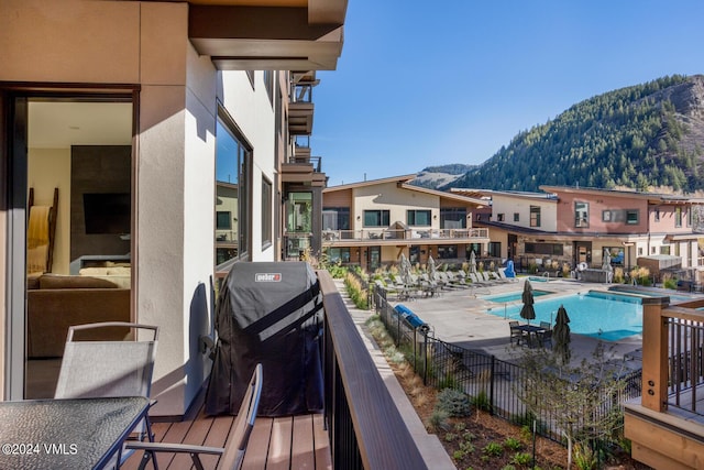 balcony with a mountain view and grilling area