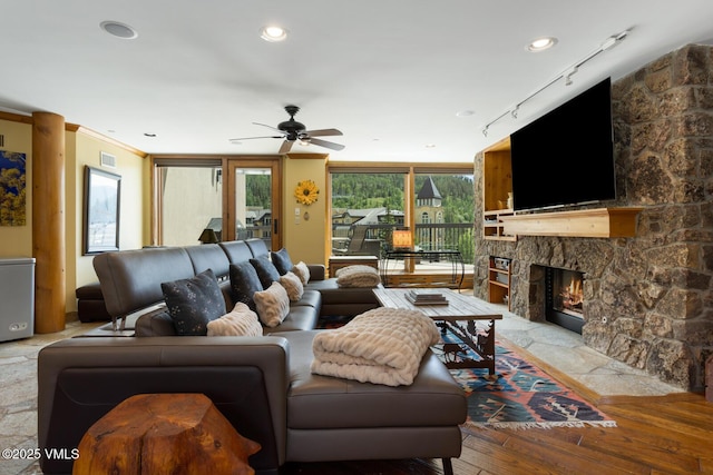 710 W Lionshead Cir Unit 501, Vail, CO 81657 - living room with ceiling fan, a fireplace, light wood finished floors, and track lighting