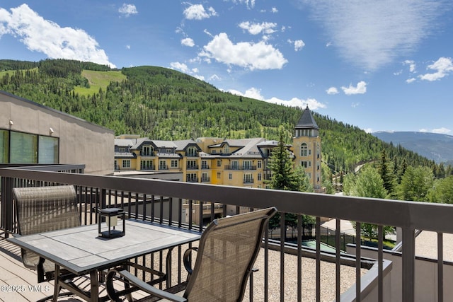 710 W Lionshead Cir Unit 501, Vail, CO 81657 - balcony with a wooded view and a mountain view