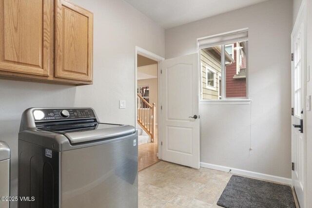 260 Longview Ave, Eagle, CO 81631 - laundry room with baseboards, cabinet space, and washer / dryer