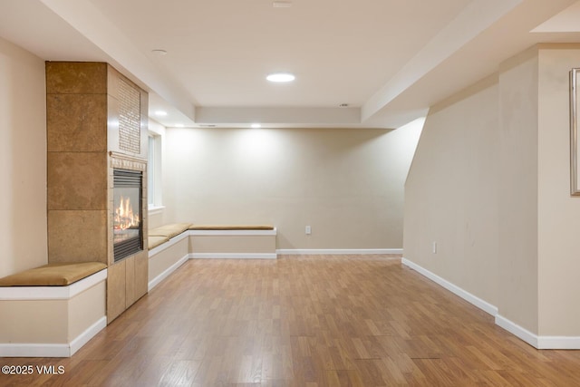 260 Longview Ave, Eagle, CO 81631 - interior space with baseboards, a tiled fireplace, recessed lighting, and light wood-style floors