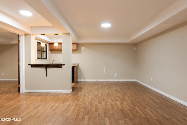 260 Longview Ave, Eagle, CO 81631 - unfurnished living room with baseboards, light wood-style flooring, and a raised ceiling