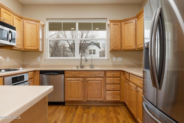 260 Longview Ave, Eagle, CO 81631 - kitchen with light countertops, a sink, appliances with stainless steel finishes, and wood finished floors