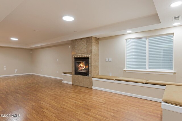 260 Longview Ave, Eagle, CO 81631 - unfurnished living room featuring a tray ceiling, visible vents, light wood-style flooring, and recessed lighting