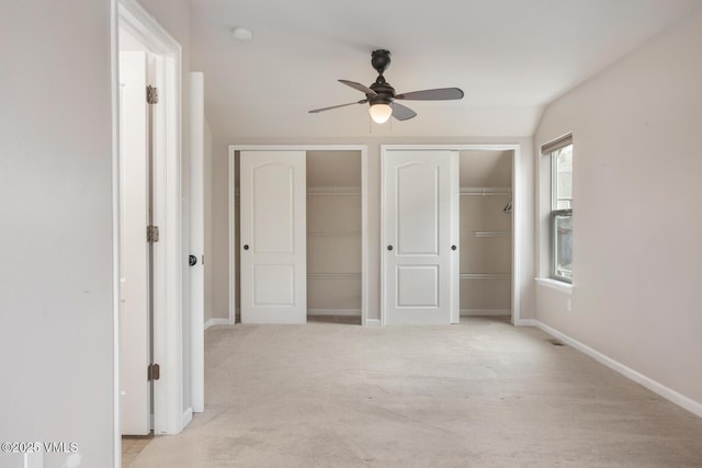 260 Longview Ave, Eagle, CO 81631 - unfurnished bedroom with two closets, baseboards, light colored carpet, and ceiling fan