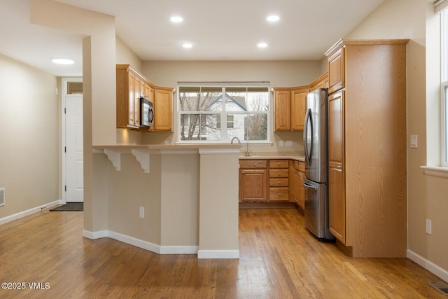 260 Longview Ave, Eagle, CO 81631 - kitchen with light countertops, light wood-style flooring, baseboards, recessed lighting, and appliances with stainless steel finishes