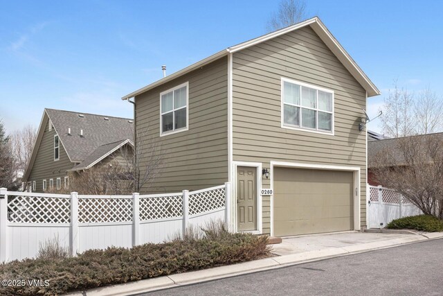 260 Longview Ave, Eagle, CO 81631 - view of side of property featuring an attached garage and fence