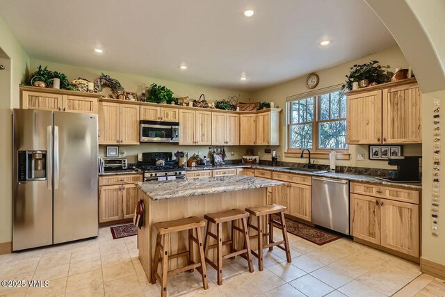 1987 Eagle Ranch Rd, Eagle, CO 81631 - kitchen featuring stainless steel appliances, a sink, a center island, recessed lighting, and a breakfast bar area