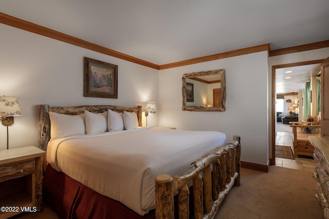 carpeted bedroom with ornamental molding