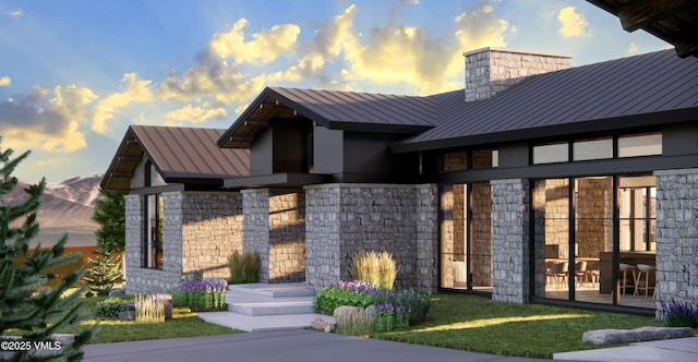 72 New York Mountain Rd, Eagle, CO 81631 - modern home with a standing seam roof, a metal roof, and stone siding