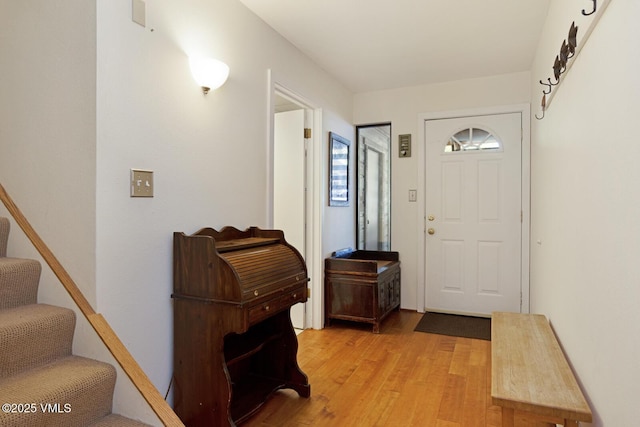 4506 Spruce Way Unit 2, Vail, CO 81657 - entrance foyer featuring light wood-style floors and stairway