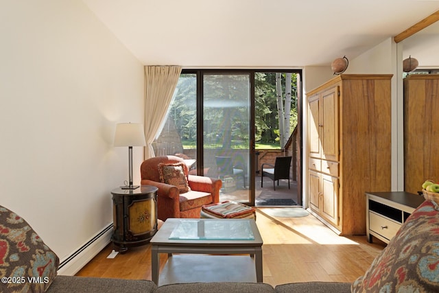 4506 Spruce Way Unit 2, Vail, CO 81657 - living area featuring a baseboard radiator, light wood-type flooring, and floor to ceiling windows