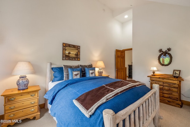 25 Cottage Cir, Edwards, CO 81632 - bedroom with light carpet, baseboards, and high vaulted ceiling