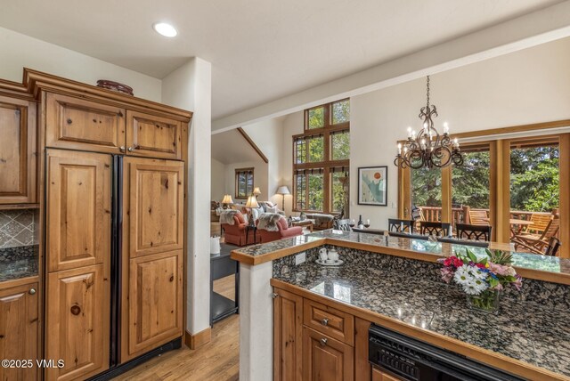 25 Cottage Cir, Edwards, CO 81632 - kitchen featuring dishwashing machine, light wood-style flooring, tile counters, a chandelier, and recessed lighting