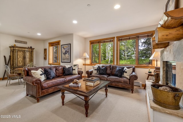 25 Cottage Cir, Edwards, CO 81632 - living room featuring baseboard heating, light carpet, recessed lighting, a glass covered fireplace, and baseboards
