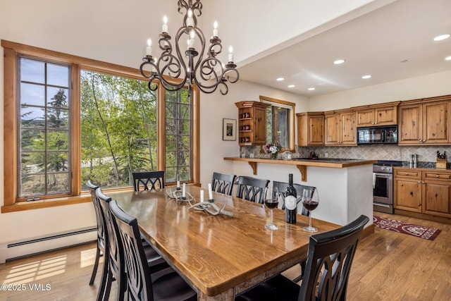 25 Cottage Cir, Edwards, CO 81632 - dining area featuring a baseboard heating unit, light wood-type flooring, a chandelier, and recessed lighting
