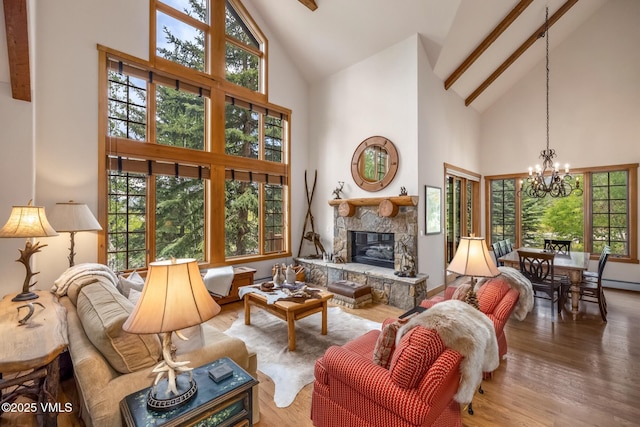 25 Cottage Cir, Edwards, CO 81632 - living room with high vaulted ceiling, a chandelier, a fireplace, and wood finished floors