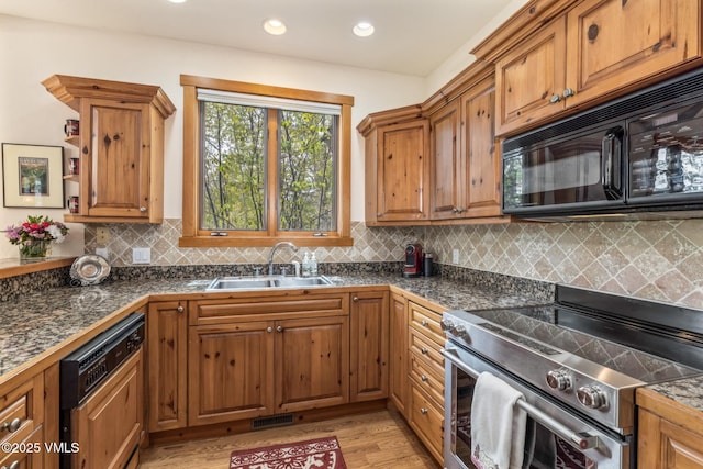 25 Cottage Cir, Edwards, CO 81632 - kitchen with stainless steel electric range oven, black microwave, a sink, dishwasher, and brown cabinets