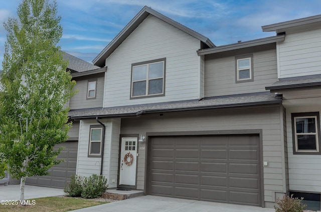 404 Chickadee Ln, Gypsum, CO 81637 - multi unit property with a garage, concrete driveway, and roof with shingles