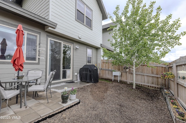 404 Chickadee Ln, Gypsum, CO 81637 - fenced backyard featuring grilling area and a patio area