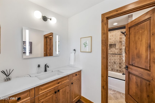 bathroom with vanity and tiled shower / bath