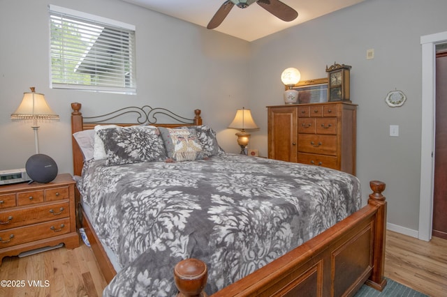 511 Metcalf Rd Unit I27, Avon, CO 81620 - bedroom with light wood-type flooring, baseboards, and a ceiling fan