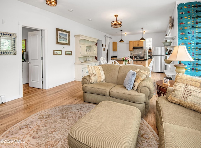 511 Metcalf Rd Unit I27, Avon, CO 81620 - living area featuring light wood finished floors and baseboards