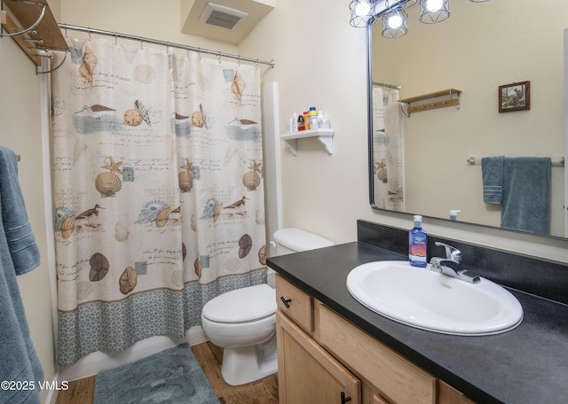 511 Metcalf Rd Unit I27, Avon, CO 81620 - bathroom featuring toilet, vanity, wood finished floors, and a shower with curtain