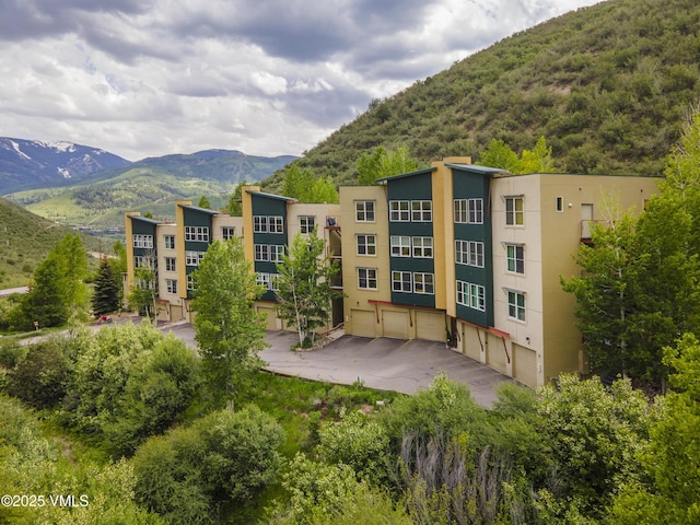 511 Metcalf Rd Unit I27, Avon, CO 81620 - view of property featuring a mountain view and a garage