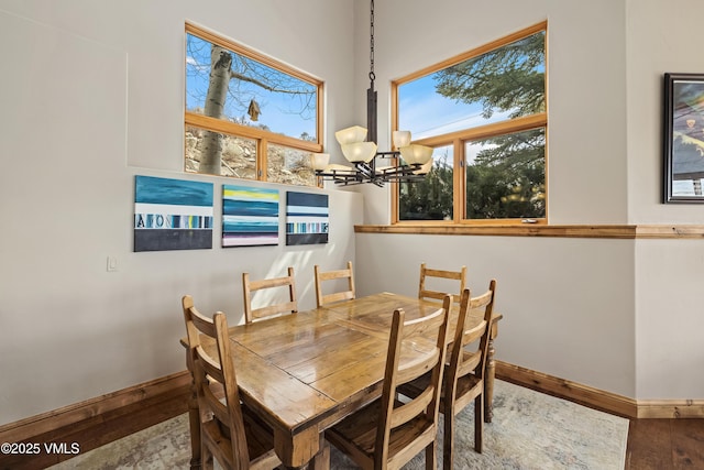 2960 June Creek Trl Unit A, Avon, CO 81620 - dining room featuring a chandelier, plenty of natural light, and wood finished floors
