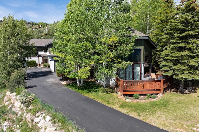 2960 June Creek Trl Unit A, Avon, CO 81620 - obstructed view of property with a wooden deck and a front yard
