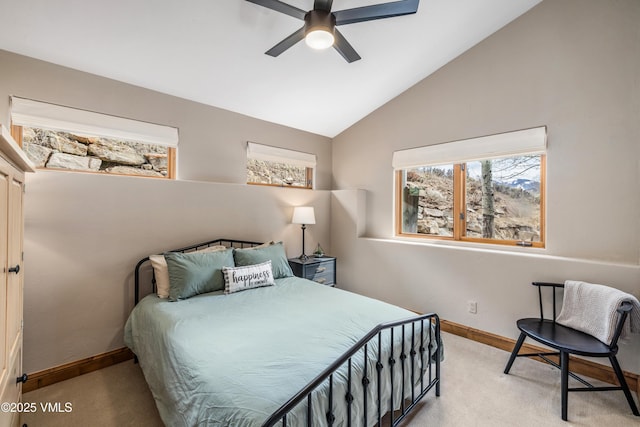 2960 June Creek Trl Unit A, Avon, CO 81620 - carpeted bedroom with multiple windows, vaulted ceiling, and a ceiling fan