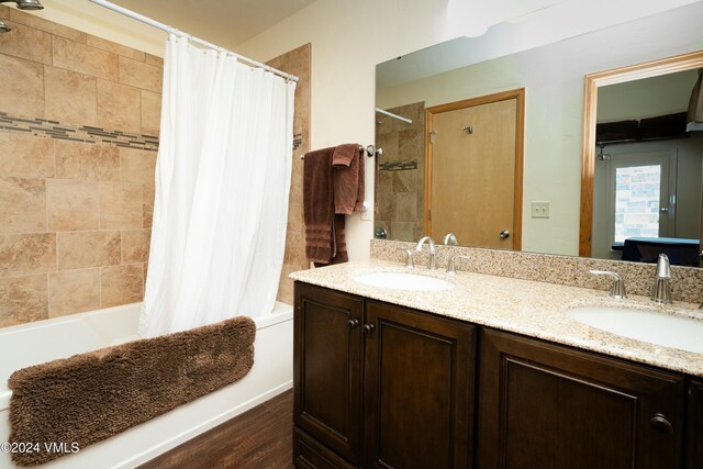 bathroom with vanity and shower / bath combination with curtain