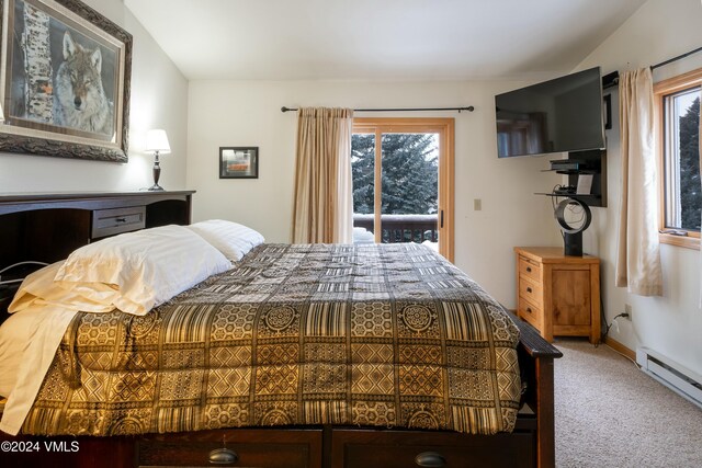 bedroom with access to exterior, carpet floors, a baseboard radiator, and vaulted ceiling