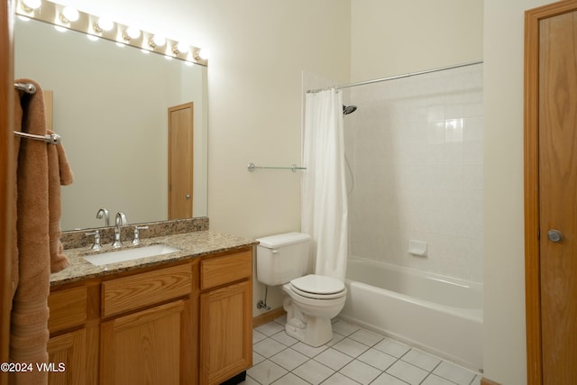 full bathroom featuring tile patterned flooring, toilet, vanity, and shower / bath combo with shower curtain