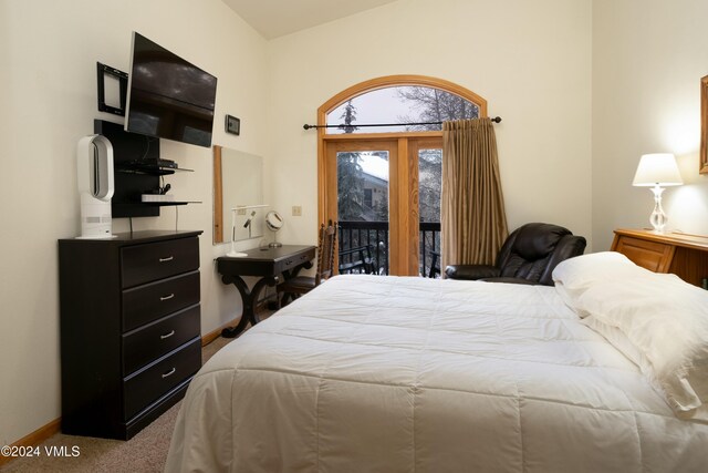 carpeted bedroom featuring access to outside