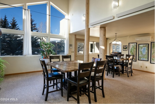 dining space featuring light colored carpet, a wall unit AC, and a high ceiling