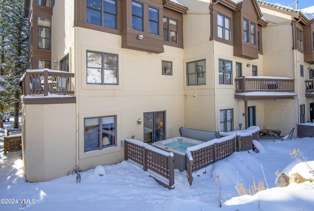 view of snow covered house