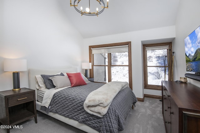 carpeted bedroom featuring an inviting chandelier and high vaulted ceiling