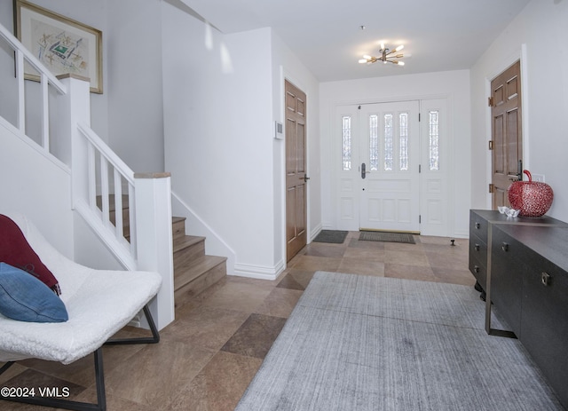 entrance foyer with a notable chandelier