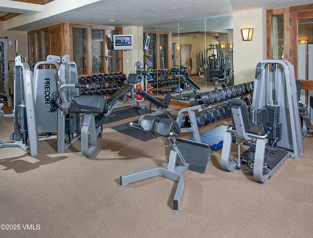 gym with a textured ceiling