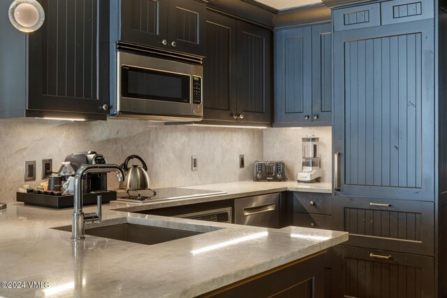 kitchen featuring sink and decorative backsplash