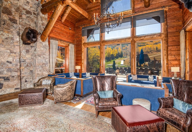 sunroom / solarium with a notable chandelier, wood ceiling, and beamed ceiling