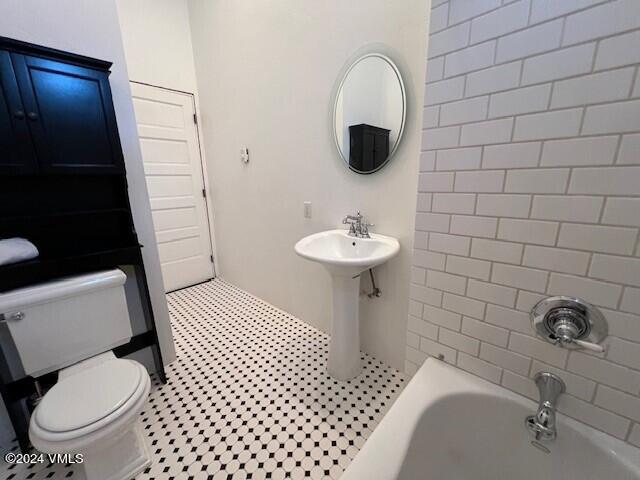 bathroom with sink and toilet