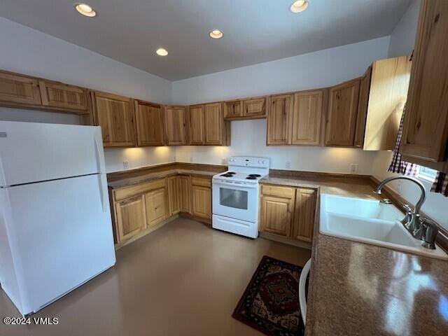 kitchen with white appliances and sink