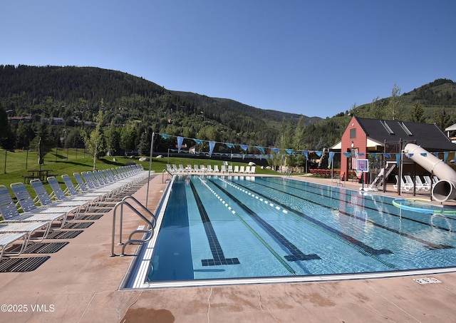 83 Larkspur Ln Unit A, Avon, CO 81620 - community pool featuring a mountain view and a view of trees