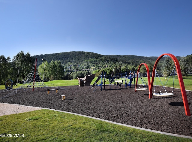 83 Larkspur Ln Unit A, Avon, CO 81620 - communal playground featuring a forest view and a yard