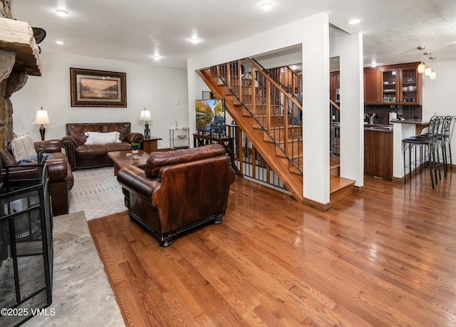 83 Larkspur Ln Unit A, Avon, CO 81620 - living area with wood finished floors, stairs, and recessed lighting